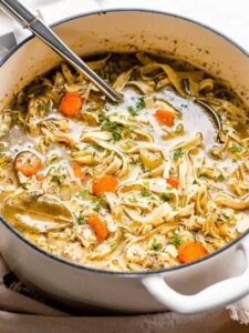 A pot of chicken noodle soup, steaming and inviting, showcasing a comforting dish from Taste of Home Recipes.