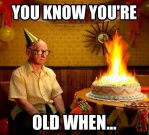  A humorous birthday scene depicting a cake on fire, symbolizing the realization of aging at a birthday party.