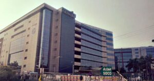 The Technology Park building showcases a large sign displaying the word India.